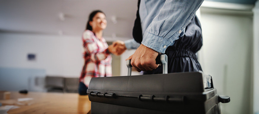 Technician meeting woman for HVAC service